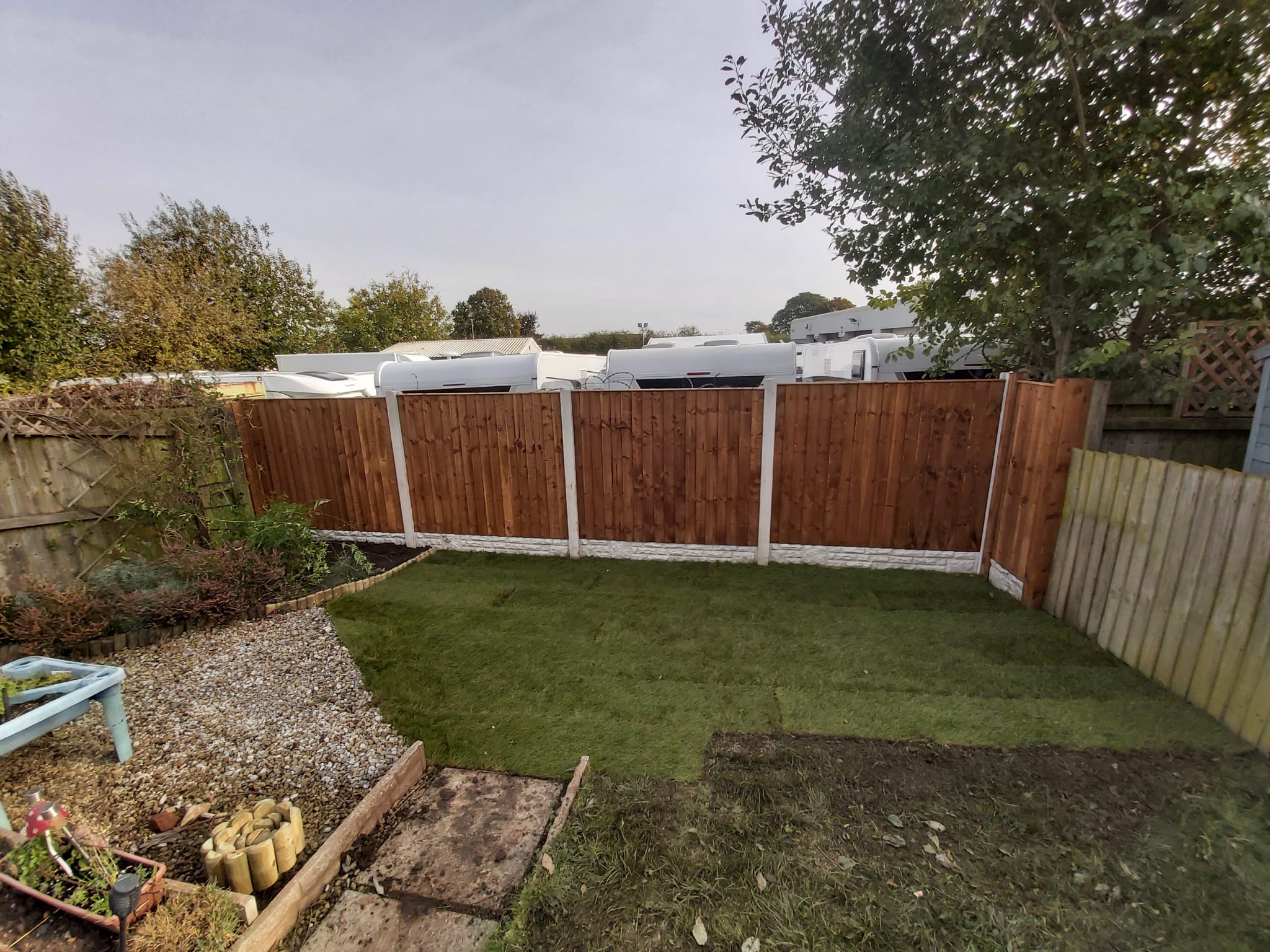 Close-board timber boundary fencing, level and cleanly finished